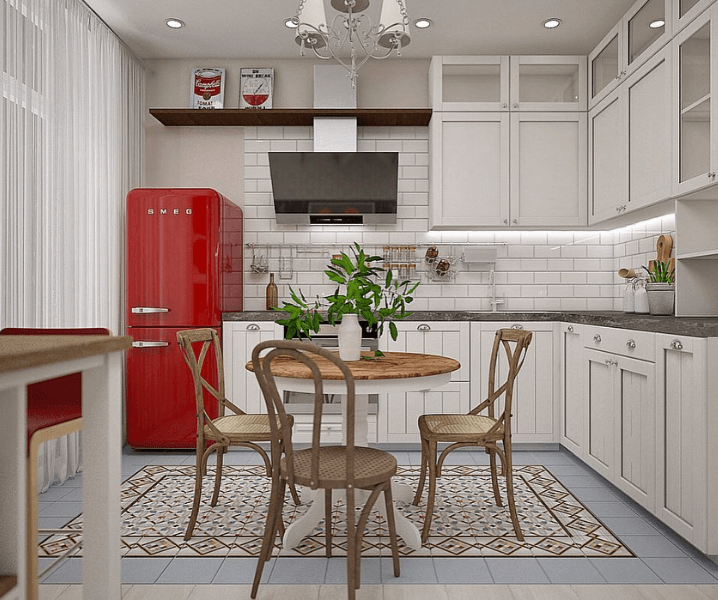 Кухня с красным холодильником и деревянными стульями